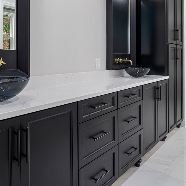 Stone countertop and custom vanity cabinet installed in a Leander bathroom